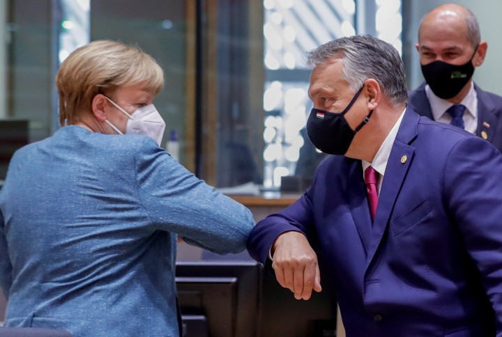 Angela Merkel and Viktor Orbán greet each other at the Brussels EU summit on 1 October 2020. Photo: Olivier HOSLET / POOL / AFP